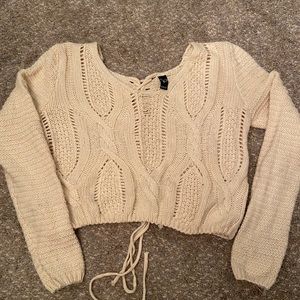 Knit sweater with adjustable drawstring waist